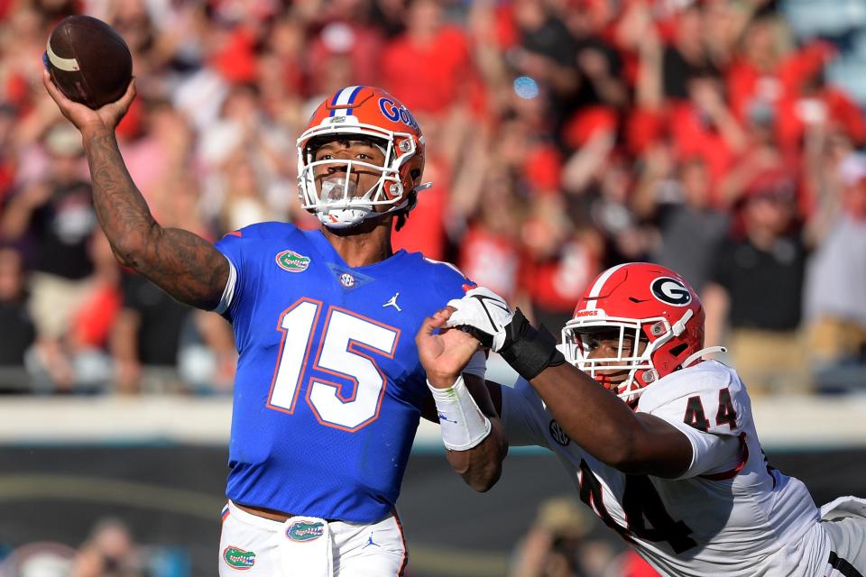 Florida quarterback Anthony Richardson (15) gets off a pass under pressure from Georgia's Travon Walker during last year's Georgia-Florida game. Walker is now with the Jaguars.