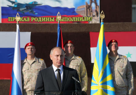 Russian President Vladimir Putin addresses servicemen as he visits the Hmeymim air base in Latakia Province, Syria December 11, 2017. Sputnik/Mikhail Klimentyev/Sputnik via REUTERS