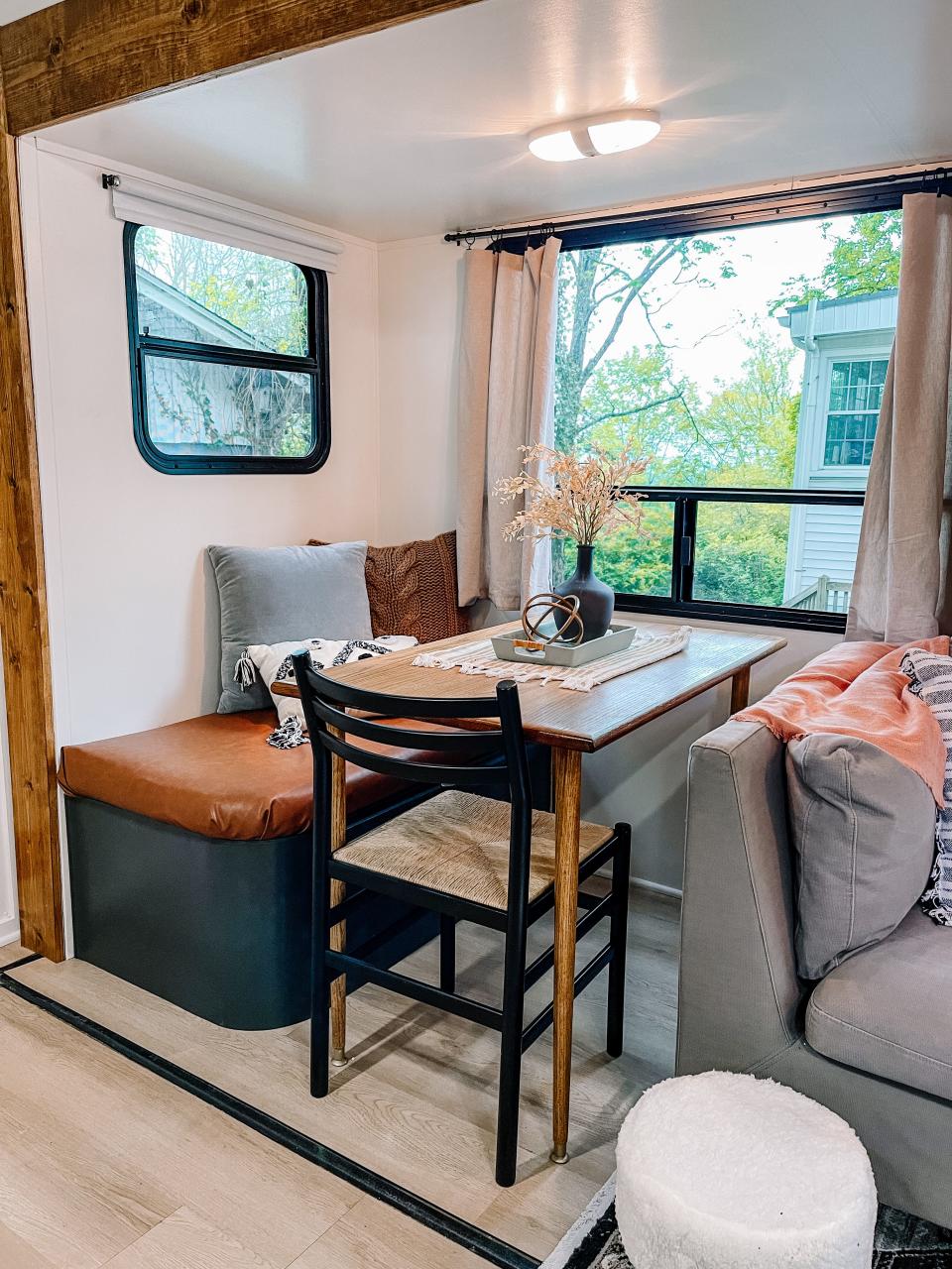 The typical dinette seating was removed and Kat Chandler added the bench seat with storage, and a cheap chair from KARM was given a coat of paint. Her husband custom made the table for the camper. Fountain City, April 14, 2023