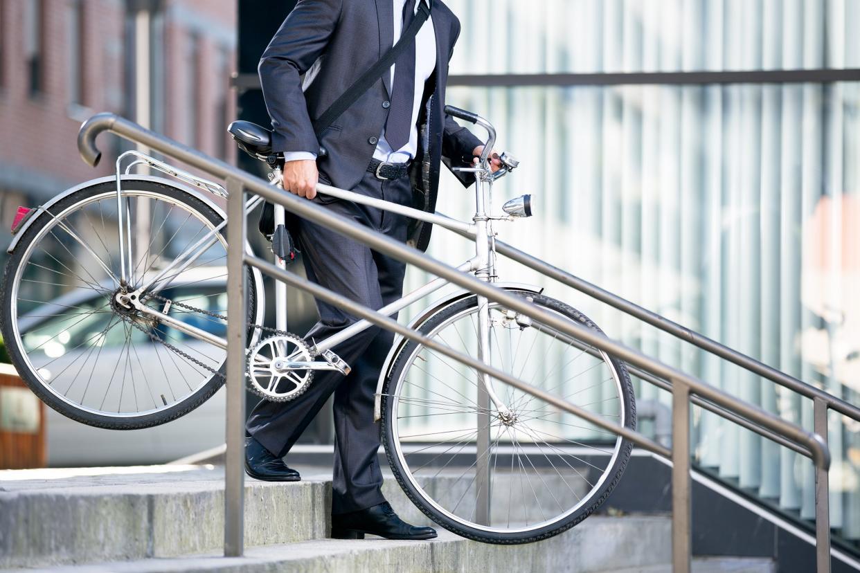 business man and his bicycle, concept bike go to work