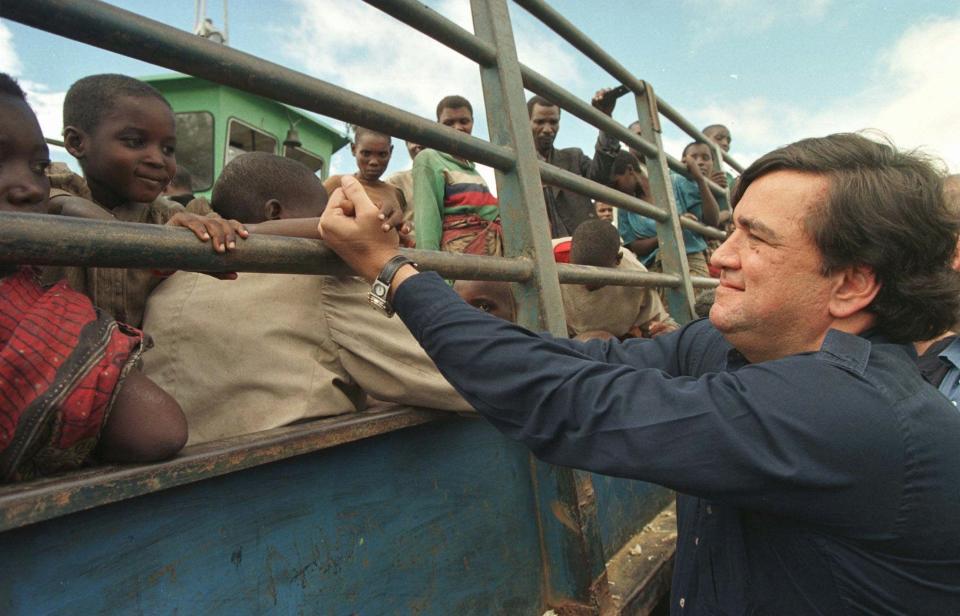 U.S. Ambassador to the United Nations Bill Richardson greets Rwandan refugees being evacuated by the United Nations from Kisangani, Zaire, in April 1997.