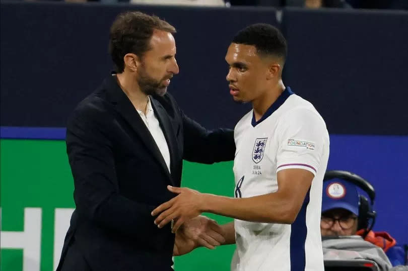 Gareth Southgate shakes hands with Trent Alexander-Arnold as he's substituted in England's Euro 2024 opener against Serbia