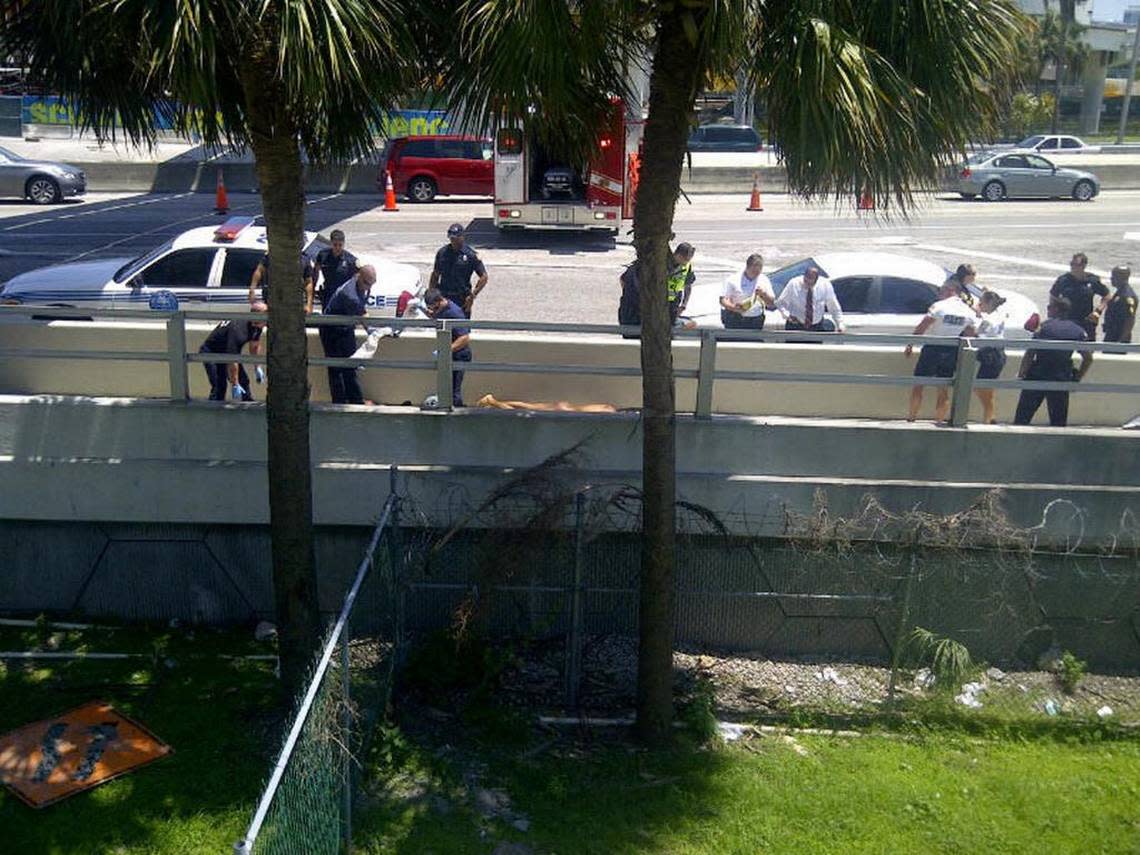 
CAUSEWAY CANNIBAL SCENE: This was the scene on a walkway along the MacArthur Causeway, which connects the downtown Miami with Watson Island and Miami Beach, on Memorial Day, Saturday, May 26, after an attacker named Rudy Eugene beat and gnawed away most of the face of homeless man Ronald Poppo.
