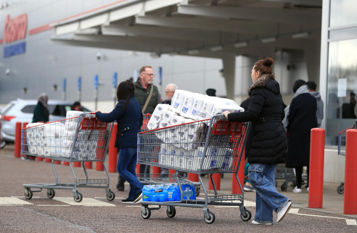 RETRANSMITTED ADDING LOCATION Customers stock up on toilet roll at Costco in Leicester as the Chancellor is to unveil an emergency package aimed at protecting workers' jobs and wages as they face hardship in the fight against the coronavirus pandemic. (Photo by Mike Egerton/PA Images via Getty Images)