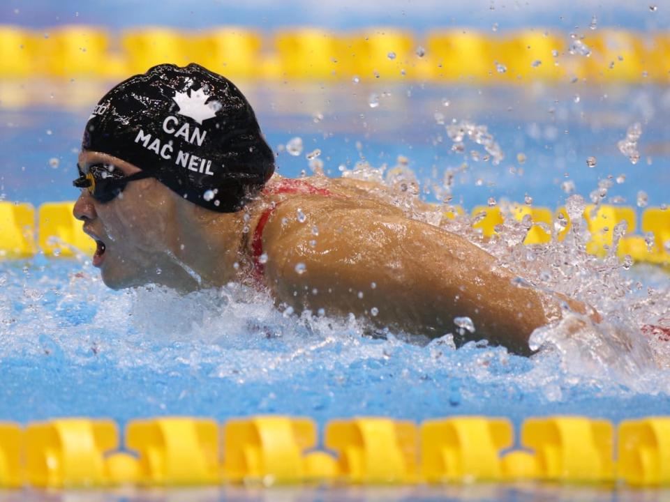 Maggie Mac Neil, seen above in 2023, finished second to Summer McIntosh in the 100-metre fly final at the Canadian Swimming Open in Toronto on Friday. (Adam Pretty/Getty Images/File - image credit)