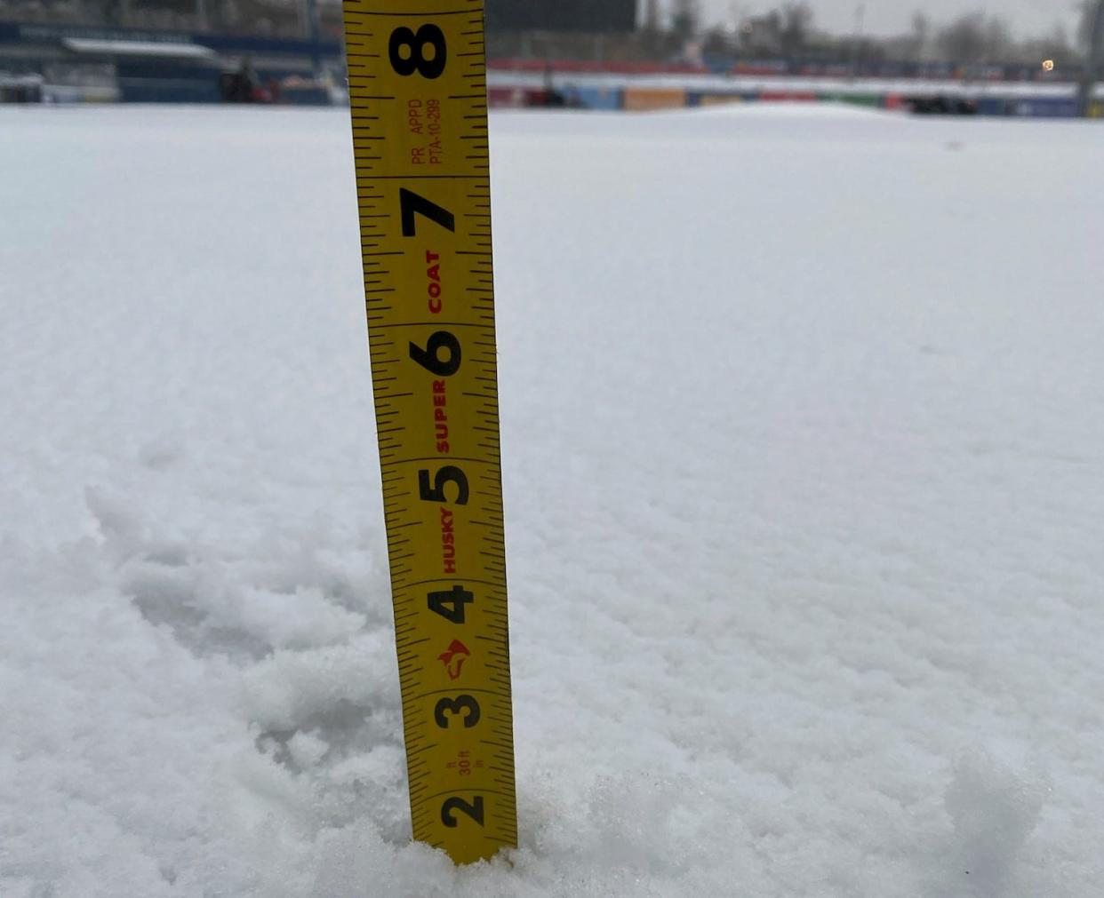 The WooSox grounds crew measured the snow fall at Polar Park on Thursday, April 4, 2024.