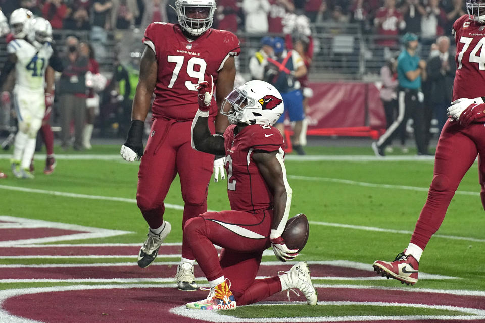 Arizona Cardinals running back Chase Edmonds (2) celebrates his touchdown against the Indianapolis Colts during the first half of an NFL football game, Saturday, Dec. 25, 2021, in Glendale, Ariz. (AP Photo/Rick Scuteri)