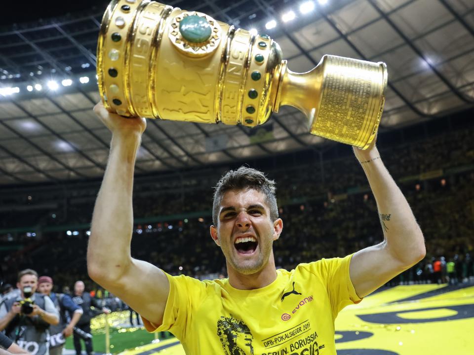 Christian Pulisic of Dortmund celebrates with a trophy after winning the DFB Cup final match between Eintracht Frankfurt and Borussia Dortmund at Olympiastadion on May 27, 2017 in Berlin, Germany.