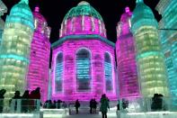 <p>Tourists enjoy spectacular ice and snow sculptures at the Harbin Ice and Snow World park in Harbin, China, on Jan. 2. (Photo: Sipa Asia/REX/Shutterstock) </p>