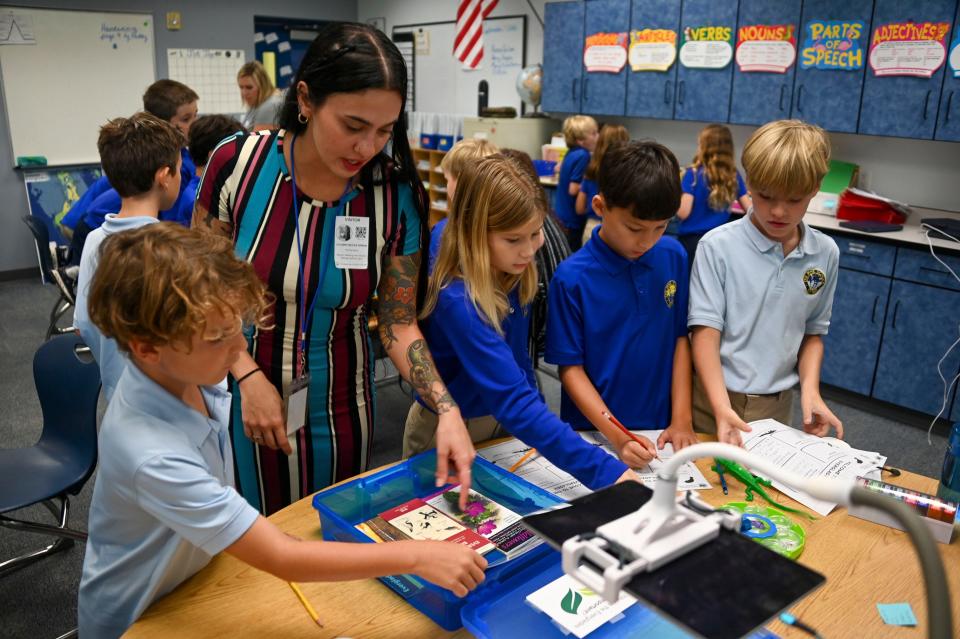 Young Friends of the Everglades Karen Mashburn Environmental Scholar Autumn Bryan works with fourth grade students at The Pine School on Sept. 14, 2023, in Hobe Sound.