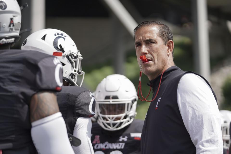 Cincinnati head coach Luke Fickell leads warmups before a game against Murray State.