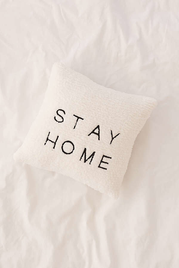 Get it <a href="https://www.urbanoutfitters.com/shop/stay-home-embroidered-amped-fleece-throw-pillow?category=decorative-pillows-throw-blankets&amp;color=010" target="_blank">here</a>.&nbsp;