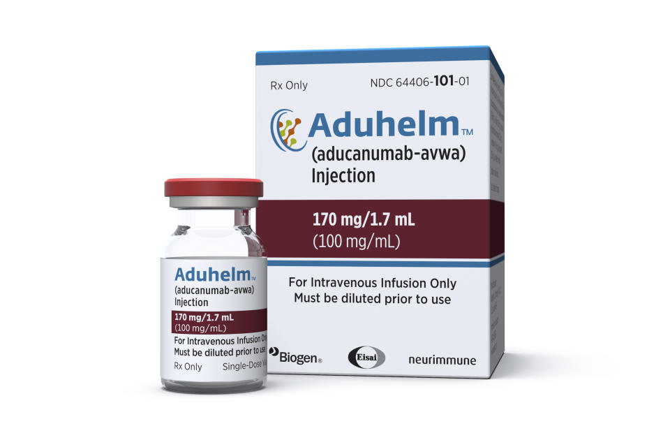 This image provided by Biogen on Monday, June 7, 2021 shows a vial and packaging for the drug Aduhelm. (Biogen via AP)