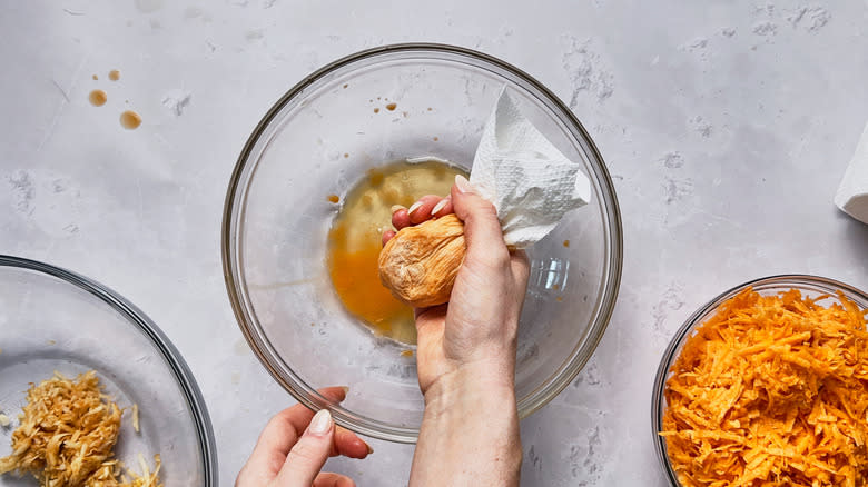 wringing potatoes in paper towel