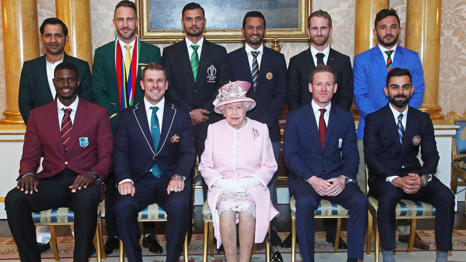 Back row (L-R) Sarfaraz Ahmed (Pakistan), Faf du Plessis (South Africa), Masrafe Bin Mortaza (Bangladesh), Dimuth Karunaratne (Sri Lanka), Kane Williamson (New Zealand), Gulbadin Naib (Afghanistan), front row (L-R) Jason Holder (West Indies), Aaron Finch (Australia), Queen Elizabeth II, Eoin Morgan (England) and Virat Kohli (India). (Photo by Yui Mok - WPA Pool/Getty Images)