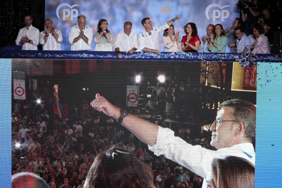 Alberto Feijoo, leader of the mainstream conservative Popular Party, gestures to supporters outside the party headquarters following Spain's general election, in Madrid, Monday, July 24, 2023. Spain's conservative Popular Party is set to narrowly win the country's national election but without the majority needed to topple the coalition government of Socialist Prime Minister Pedro Sánchez. (AP Photo/Manu Fernandez)