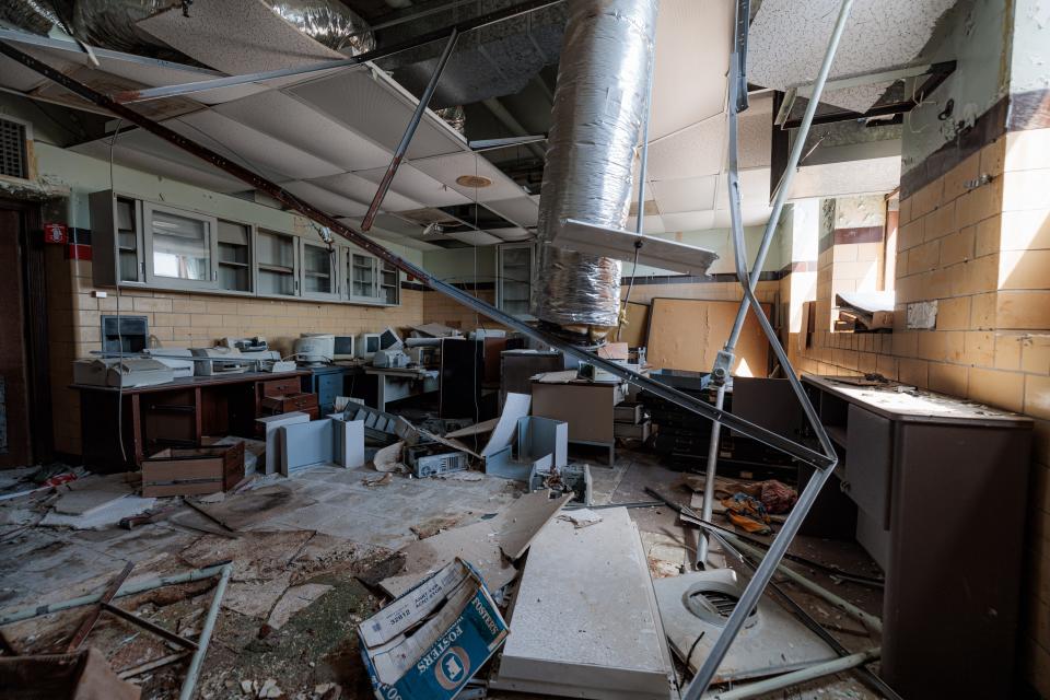 Hassenflu's building at 220 NW Virginia is in complete shambles, with walls, floors and ceilings torn open to expose the valuable copper.