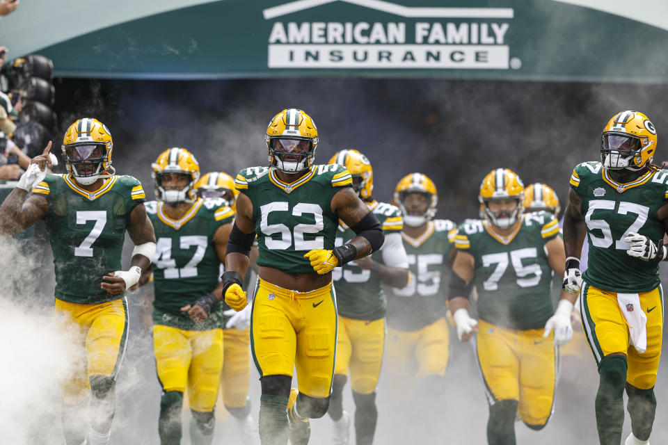Green Bay Packers linebacker Rashan Gary (52) and Green Bay Packers linebacker Brenton Cox Jr. (57) during introductions before the first half of a NFL football game against the New Orleans Saints Sunday, Sept. 24, 2023, in Green Bay, Wis. (AP Photo/Jeffrey Phelps)