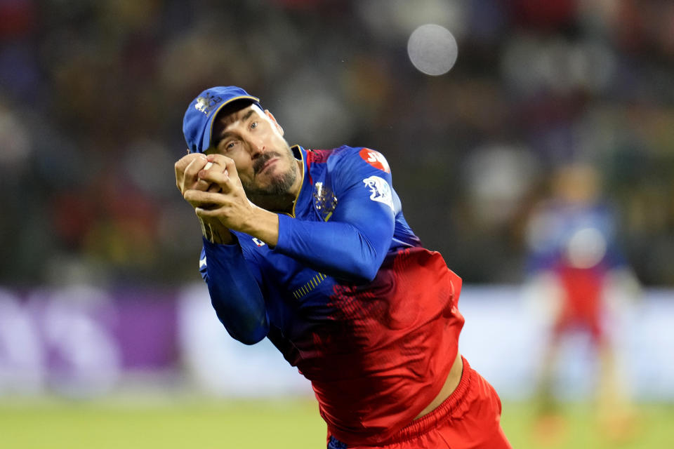 Royal Challengers Bengaluru's captain Faf du Plessis takes the catch to dismiss Lucknow Super Giants' Ayush Badoni during the Indian Premier League cricket match between Royal Challengers Bengaluru and Lucknow Super Giants in Bengaluru, India, Tuesday, April 2, 2024. (AP Photo/Aijaz Rahi)