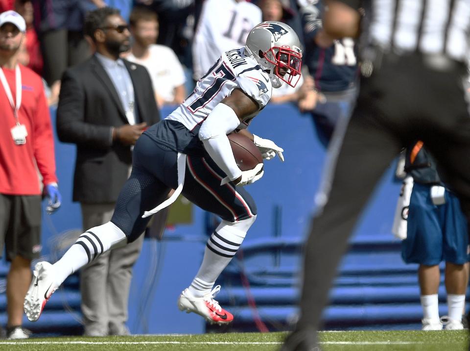 New England Patriots defensive back J.C. Jackson carries the ball after intercepting a pass by Buffalo Bills quarterback Josh Allen in the first half of an NFL football game, Sunday, Sept. 29, 2019, in Orchard Park, N.Y. (AP Photo/Adrian Kraus)