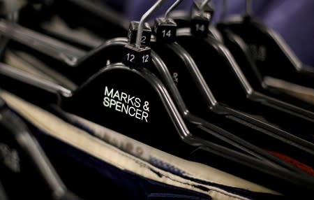 FILE PHOTO: File photo of clothes displayed on hangers in an Marks & Spencer shop in northwest London