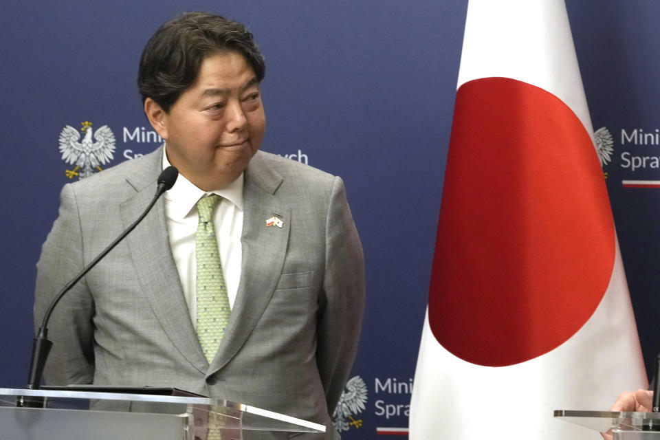 FILE - Japan's Foreign Minister Yoshimasa Hayashi listens to Poland's Foreign Minister Zbigniew Rau speaking to the media, following their talks on regional security and support for Ukraine at Poland's Foreign Ministry in Warsaw, Poland, Friday, Sept. 8, 2023. Foreign Minister Hayashi, accompanied by a number of business leaders, is visiting Ukraine on Saturday for talks with his counterpart to show support for the war-torn country and emphasize his country's backing of sanctions against Russia, the Japanese foreign ministry said in a statement. (AP Photo/Czarek Sokolowski, File)