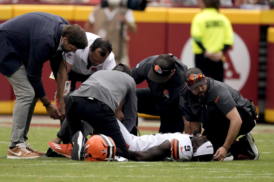 Cleveland Browns' Jakeem Grant Sr. is checked on by trainers after being injured on the opening kickoff during the first half of an NFL preseason football game against the Kansas City Chiefs Saturday, Aug. 26, 2023, in Kansas City, Mo. (AP Photo/Charlie Riedel)