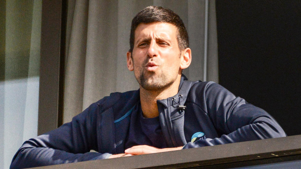 Novak Djokovic (pictured) reacting to fans from his quarantine balcony in Adelaide.