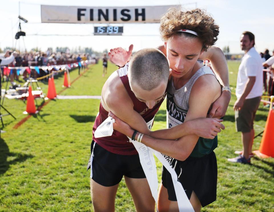 Winner JoJo Jourdon of Olympus, right, hugs second-place finisher Gabe Hooper of Viewmont after the boys 5A cross-country state championship race at the Regional Athletic Complex in Rose Park on Tuesday, Oct. 24, 2023. | Jeffrey D. Allred, Deseret News
