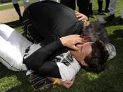 <p>Head coach for the Limon Badgers high school baseball team gives a heartfelt congratulatory hug to his pitcher, Matt Brown, after their victory against a rival team on May 22, 2010. This brings Matt to shed some happy tears. </p>