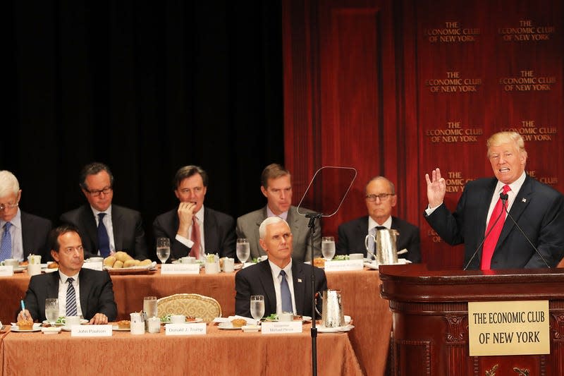 NEW YORK, NY - SEPTEMBER 15: Republican presidential candidate Donald Trump speaks at a lunch hosted by the Economic Club of New York on September 15, 2016 in New York City. Sitting behind Trump is John Paulson (left), an American hedge fund manager, and Mike Pence, Trump’s Vice Presidential candidate. According to a report by Oxford Economics, if Trump is elected to the White House growth in the US would be about 5 per cent lower than would otherwise be expected by 2021. - Photo: Spencer Platt (Getty Images)