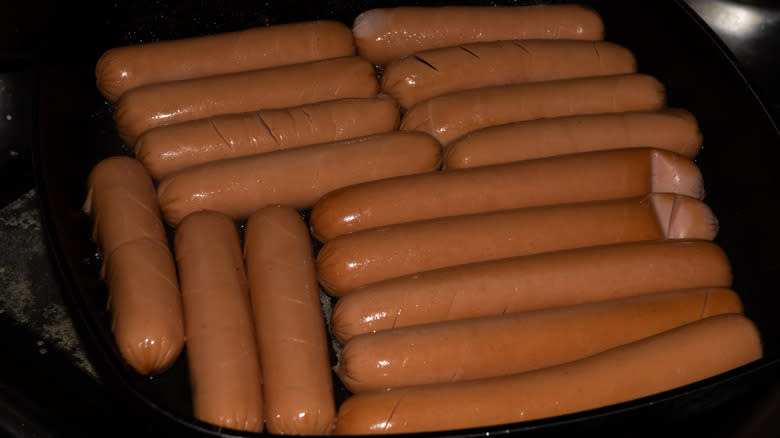 Overcrowded pan with sausages