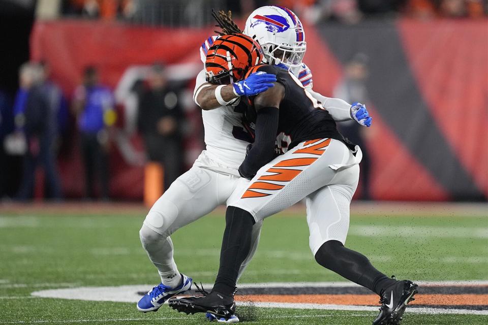 CINCINNATI, OHIO - JANUARY 02: Damar Hamlin #3 of the Buffalo Bills tackles Tee Higgins #85 of the Cincinnati Bengals during the first quarter at Paycor Stadium on January 02, 2023 in Cincinnati, Ohio. Hamlin was taken off the field by medical personnel following the play. (Photo by Dylan Buell/Getty Images)