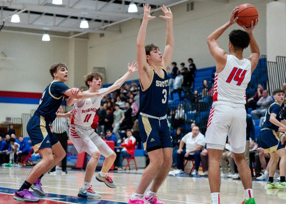 Council Rock South's Tim Rahill (3) applies pressure on Neshaminy's Guy Horton (14) as CR South's Gabe Cerulli (12) tries to prevent Neshaminy's Max Currie (11) from getting open during their boys’ basketball game in Langhorne on Friday, Jan. 26, 2024.

Daniella Heminghaus | Bucks County Courier Times