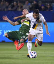 <p>Portland Timbers midfielder David Guzman, left, and Los Angeles Galaxy forward Giovani dos Santos vie for the ball during the first half of a preseason MLS soccer match, Saturday, Feb. 25, 2017, in Los Angeles. (Photo: Mark J. Terrill/AP) </p>