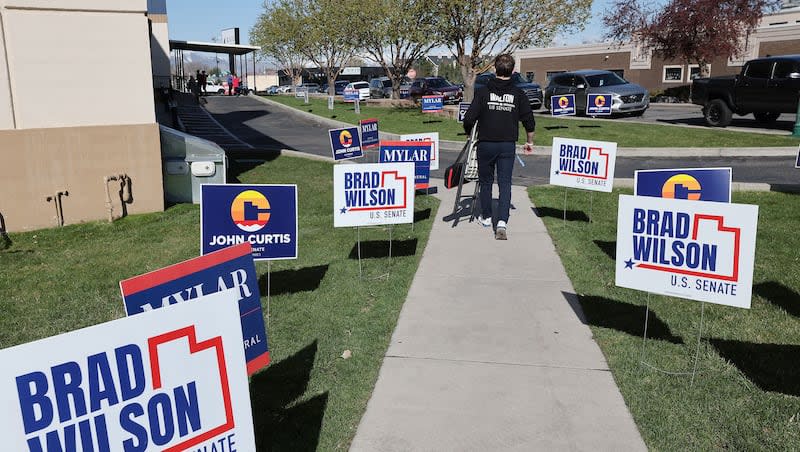 Signs are posted at the U.S. Senate candidate debate at the Scera Theatre in Orem on Wednesday, April 10, 2024.