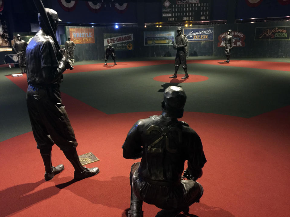 In this undated photo provided by the Negro Leagues Baseball Museum, the Field of Legends at the Negro Leagues Baseball Museum is viewed in Kansas City, Mo. The display features 10 life-size statues of Negro League greats cast in position as if they were playing a game. Former President Barack Obama tipped his cap. So did three other former presidents and a host of prominent civil rights leaders, entertainers and sports legends in a virtual salute to the 100-year anniversary of the founding of baseball’s Negro Leagues. The campaign launched Monday, June 29, 2020, with photos and videos from, among others, Hank Aaron, Rachel Robinson Derek Jeter, Colin Powell, Michael Jordan, Obama and presidents George W. Bush, Bill Clinton and Jimmy Carter at tippingyourcap.com. (Negro Leagues Baseball Museum via AP)