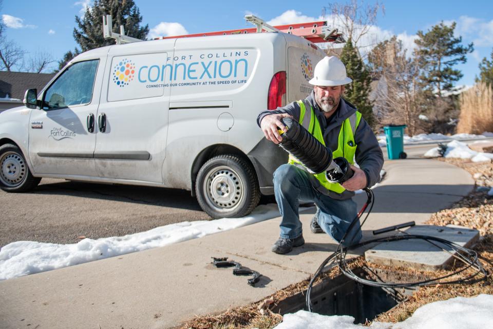 Outside Plant Supervisor Tony Gilmore finishes a repair call by placing a container housing fibers underground in this January 2023 file photo.