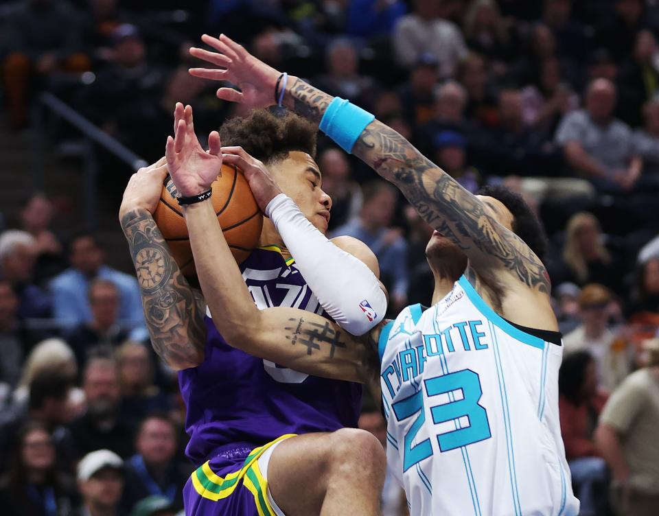 Utah Jazz guard Keyonte George (3) and Charlotte Hornets guard Tre Mann (23) compete for the ball in Salt Lake City on Thursday, Feb. 22, 2024. | Jeffrey D. Allred, Deseret News