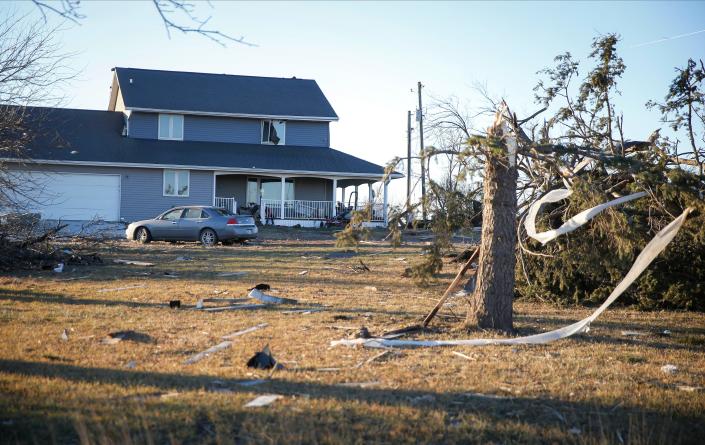 A home in rural Jefferson, Iowa, shows damage on Thursday, Dec. 16, 2021, after a band of severe weather crossed the state Wednesday night.