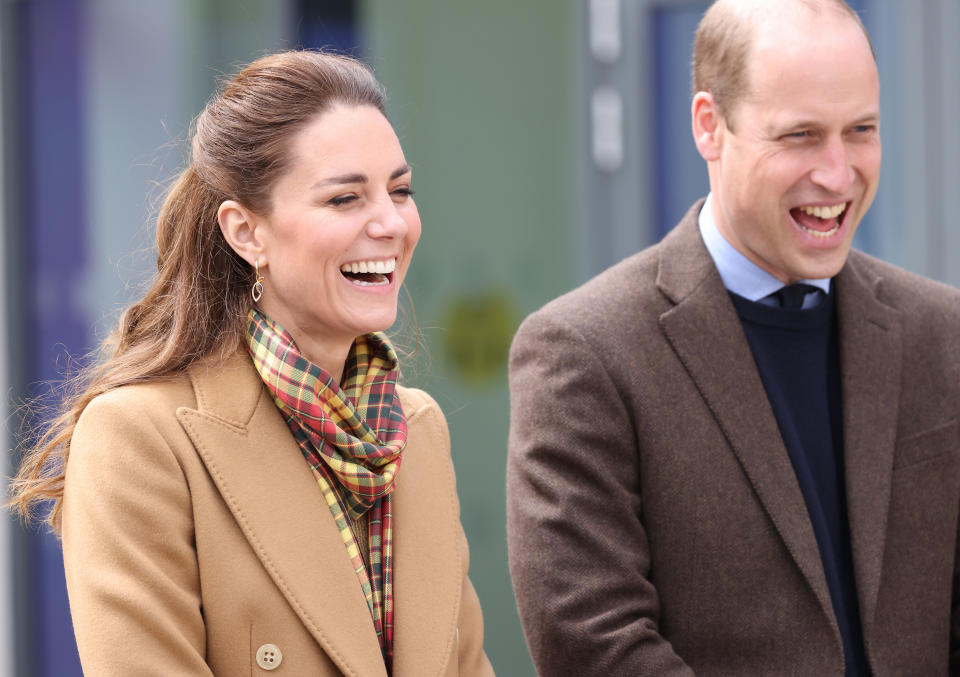 KIRKWALL, SCOTLAND - MAY 25: Prince William, Duke of Cambridge and Catherine, Duchess of Cambridge laugh as they officially open The Balfour, Orkney Hospital on day five of their week long visit to Scotland on May 25, 2021 in Kirkwall, Scotland. Recently opened in 2019, The Balfour replaced the old hospital, which had served the community for ninety years. The new facility has enabled the repatriation of many NHS services from the Scottish mainland, allowing Orkney’s population to receive most of their healthcare at home. The new building’s circular design is based on the 5000-year-old Neolithic settlement, Skara Brae, making it a unique reflection of the local landscape in which many historical sites are circles. (Photo by Chris Jackson - WPA Pool/Getty Images)