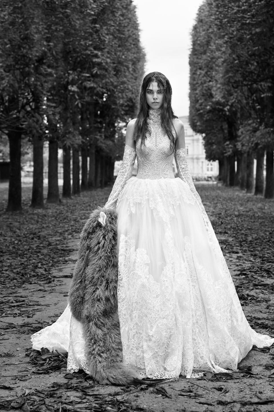 <p><i>Long-sleeve macramé lace ball gown with high neck accent and couture hand-draped skirt. (Photo: Courtesy of Vera Wang/Patrick Demarchelier) </i></p>