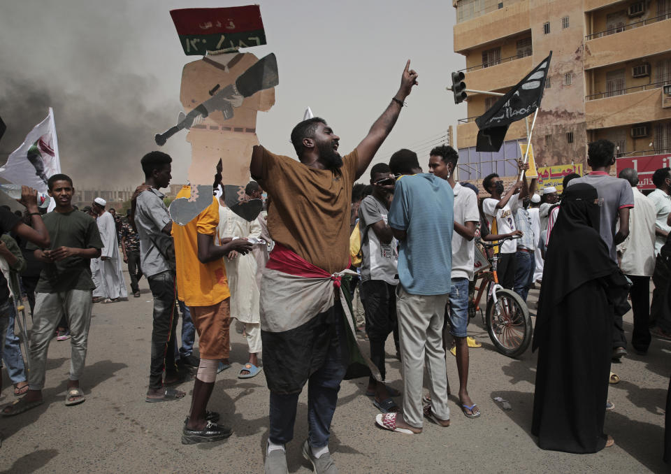 Sudanese protesters commemorate the third anniversary of a deadly crackdown carried out by security forces on protesters during a sit-in outside the army headquarters, in Khartoum, Sudan, Friday, June 3, 2022. Talks aiming at ending Sudan’s ongoing political deadlock began Wednesday, June 8, 2022, the United Nations said, although the country's main pro-democracy alliance is boycotting them over a continued police crackdown on those protesting last October's military coup. (AP Photo/ Marwan Ali)