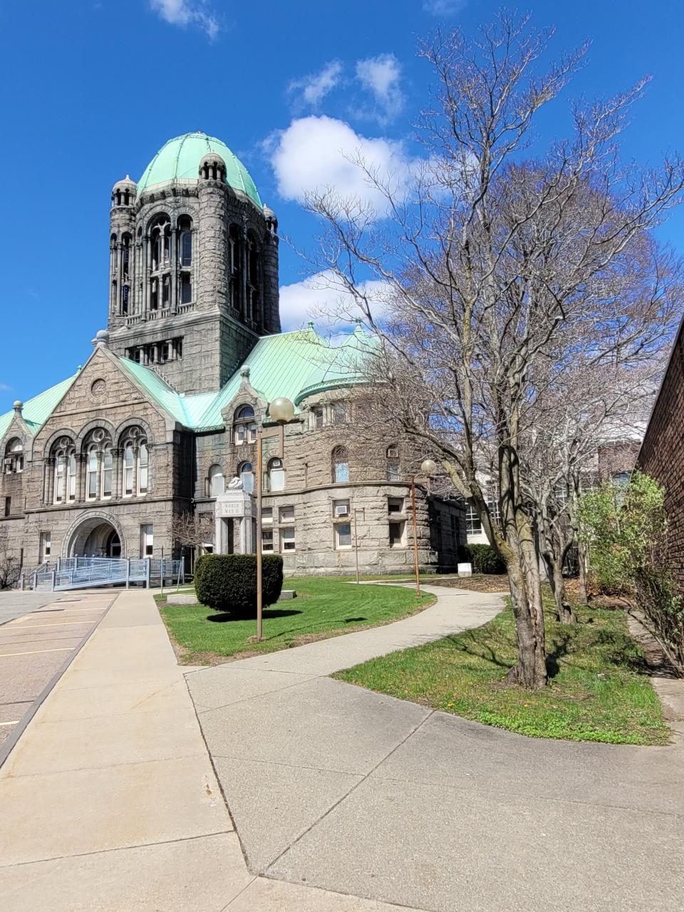 The Bristol County Superior Courthouse was built by Taunton-born architect Frank Irving Cooper. The landscaping of the grounds was planned by Frederick Olmsted's sons, John Charles and Frederick Jr., when they took over their father's firm.