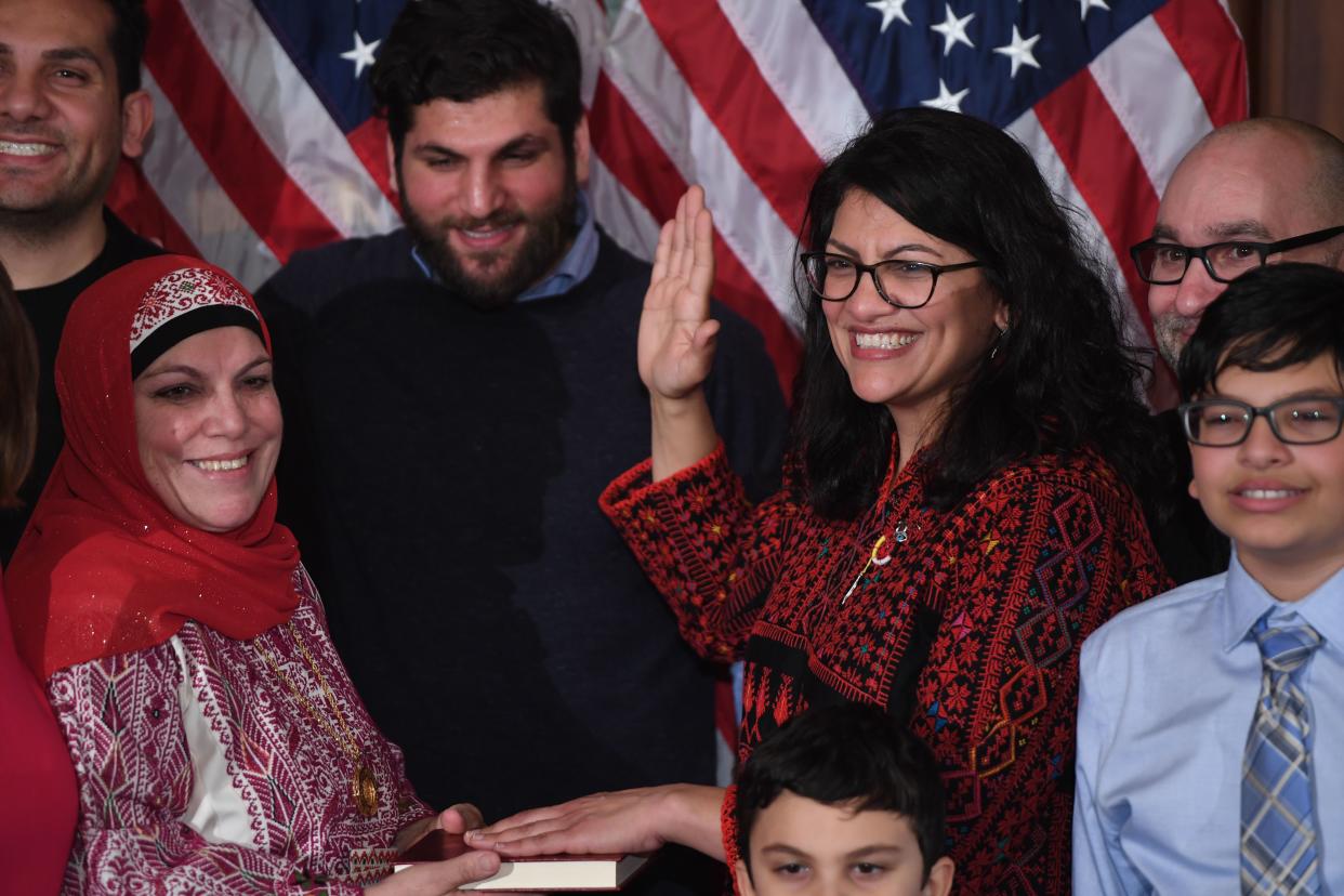 Rep. Rashida Tlaib, D-Mich., takes the oath of office, with family members present, in a ceremonial swearing-in at the U.S. Capitol on Thursday. (Photo: Saul Loeb/AFP/Getty Images)