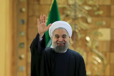 Iranian President Hassan Rouhani waves during a news conference in Tehran, Iran January 17, 2016. REUTERS/President.ir/Handout