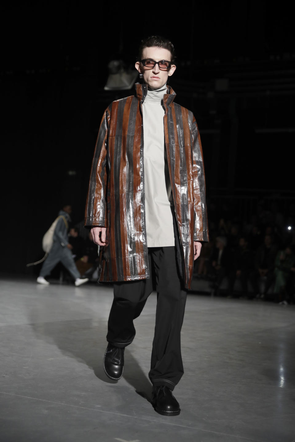 A model wears a creation as part of the Sunnei men's Fall-Winter 2020/21 collection, that was presented in Milan, Italy, Sunday, Jan. 12, 2020. (AP Photo/Luca Bruno)