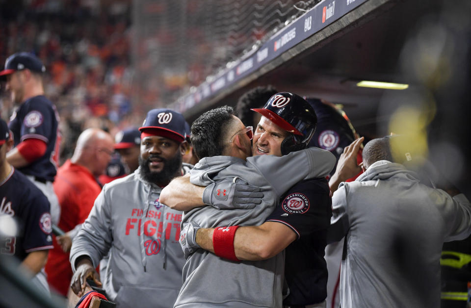 WASHINGTON, DC - OCTOBER 22: Washington Nationals first baseman Ryan Zimmerman (11), right, hugs Washington Nationals center fielder Gerardo Parra (88) after a second inning home run during Game 1 of the World Series between the Washington Nationals and the Houston Astros at Minute Maid Park on Tuesday, October 22, 2019. (Photo by John McDonnell/The Washington Post via Getty Images)