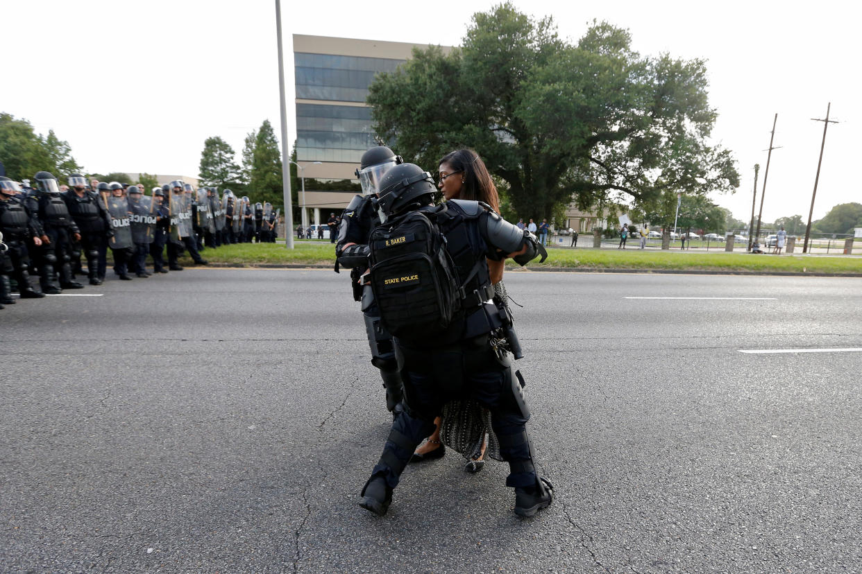 Protestor Ieshia Evans is detained by law enforcement near the headquarters of the Baton Rouge Police Department in Baton Rouge, Louisiana, U.S. July 9, 2016.   REUTERS/Jonathan Bachman        SEARCH "#BLACK LIVES MATTER" FOR THIS STORY. SEARCH "THE WIDER IMAGE" FOR ALL STORIES. 