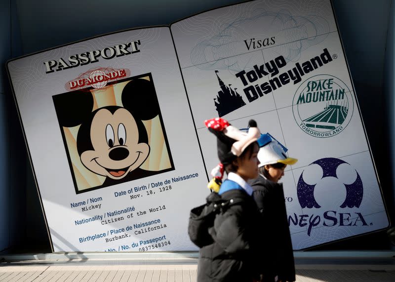 Visitors are seen outside Tokyo Disneyland in Urayasu